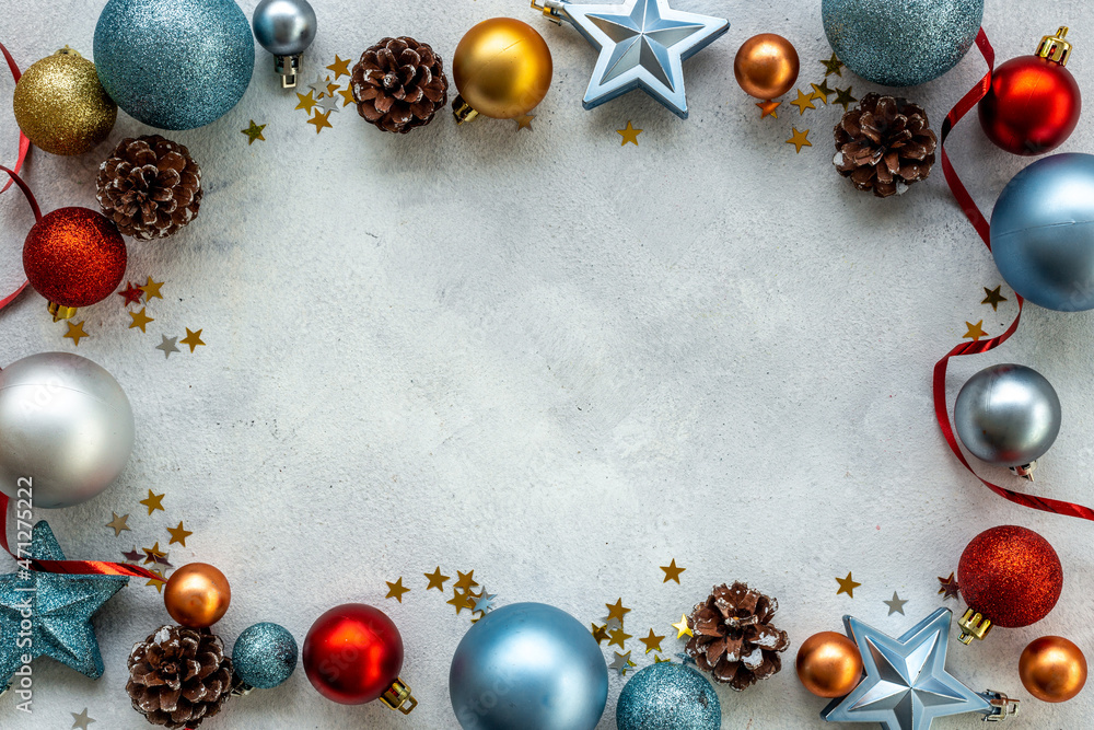Christmas and New Year decoration frame with baubles and toys. Flat lay. Empty space for text Christmas and New Year decoration frame with baubles and toys. Flat lay. Empty space for text