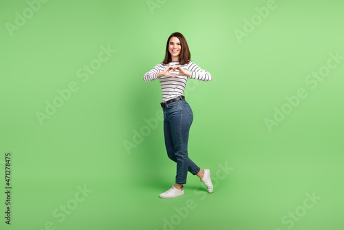 Full body profile side photo of young cheerful lady show fingers heart symbol love isolated over green color background