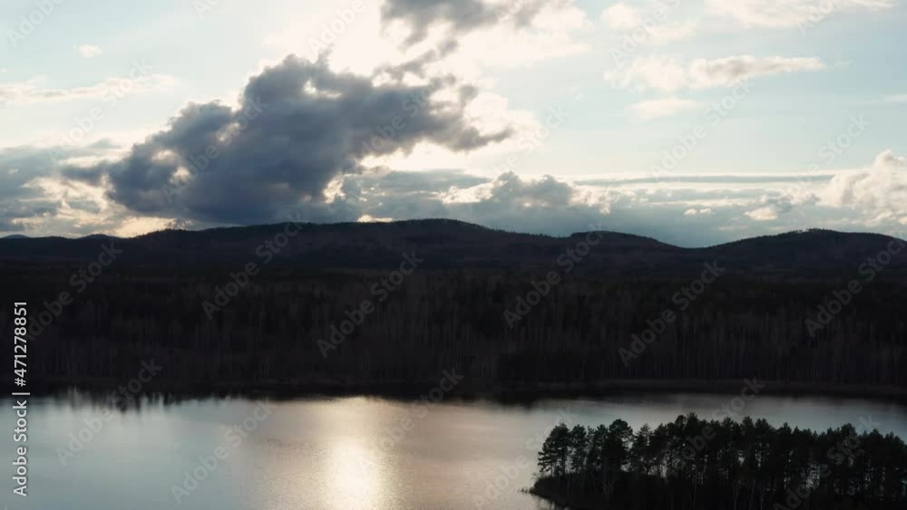 Aerial view of the natural landscape forest on the lake shore at sunset Aerial view of the natural landscape forest on the lake shore at sunset