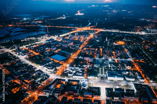 Brest  Belarus. Top View Of Cityscape Skyline City In Night Illuminations. Aerial View Of Lenin Square  Lenin Street  Stadium In Evening Illumination