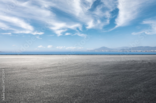 Canvas Print Asphalt road and sea scenery, road and sky background.