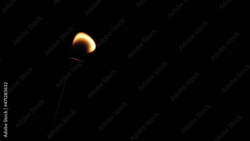 Close up flame from lighter isolated on black background. The fire from the tube burns, wriggles, dances, burns efficiently Close up flame from lighter isolated on black background. The fire from the tube burns, wriggles, dances, burns efficiently