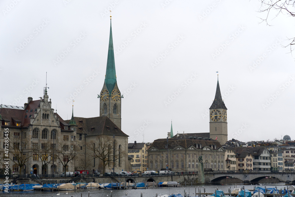 Women's Minster church and St. Peter church at the old town of Zürich on a gray autumn day. Photo taken November 22nd, 2021, Zurich, Switzerland.