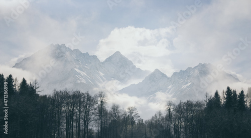 intense mood mountain range in switzerland alps, strong clouds and bright light at midday © Kay Wiegand