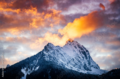 extremely burning clouds in the evening sky over the gehrenspitze with freshly snow-covered rocks in autumn
