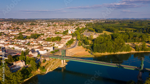 Fotografía View from drone of summer Marmande cityscape with Notre-Dame de Marmande, France