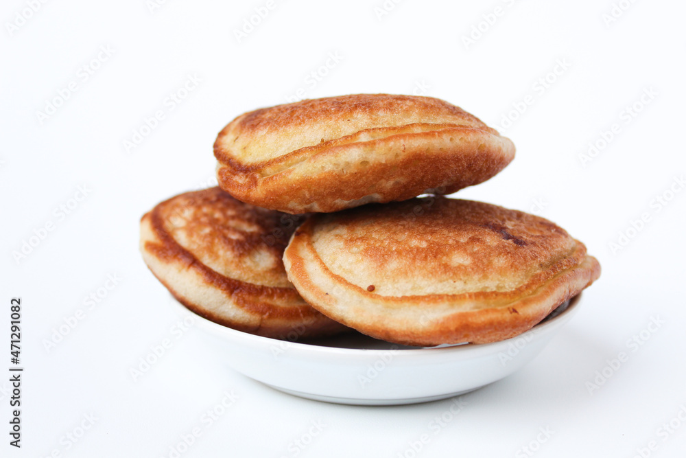 Kue Samir or Kamir or Khamir, traditional pancake from Pemalang, Indonesia. Isolated on whte background. Side view.