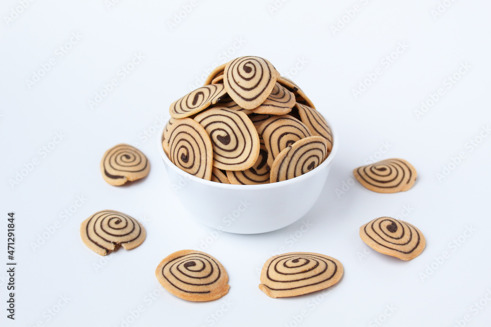 Kue Kuping Gajah, traditional cookies from Indonesia. Sweet and crunchy, unique spiral pattern. Isolated in white background. Kue Kuping Gajah, traditional cookies from Indonesia. Sweet and crunchy, unique spiral pattern. Isolated in white background.
