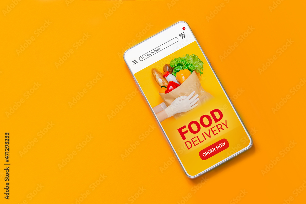 Mobile phone with online application about fast food delivery and text isolated on orange background, top view