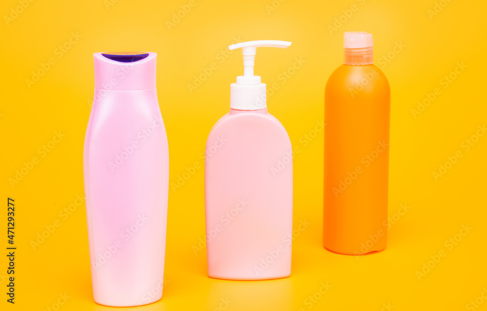 Shampoo, conditioner and lotion liquid toiletry product containers in row, bottles Shampoo, conditioner and lotion liquid toiletry product containers in row, bottles