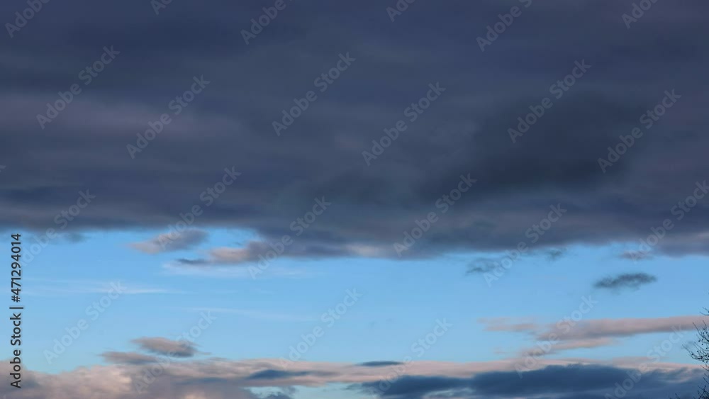 Time-lapse video of fast moving clouds with a clearly defined area of blue sky Time-lapse video of fast moving clouds with a clearly defined area of blue sky