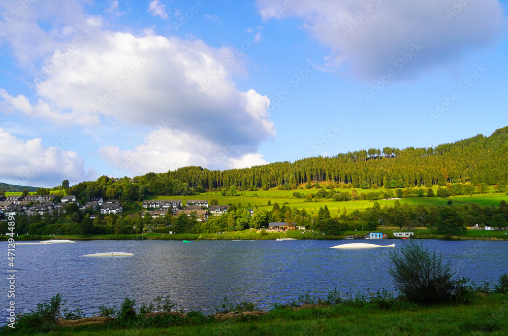 Hillestausee in the Sauerland with the surrounding nature. Landscape with a lake in the foreground. Hillestausee in the Sauerland with the surrounding nature. Landscape with a lake in the foreground.