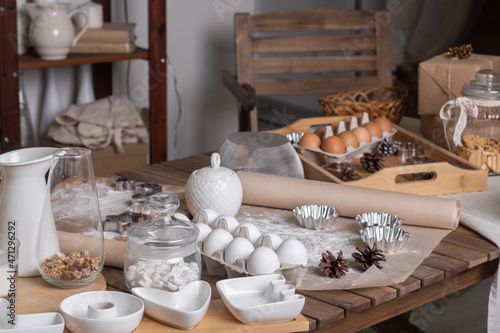 Composition of ingredients for a delicious homemade cake on a wooden table.