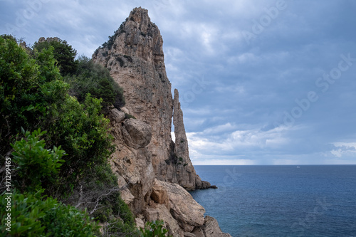 Pedra Longa in Sardinia Italy. Rocky shore by the ocean. Rocky beach during dusk.  © LP Productions