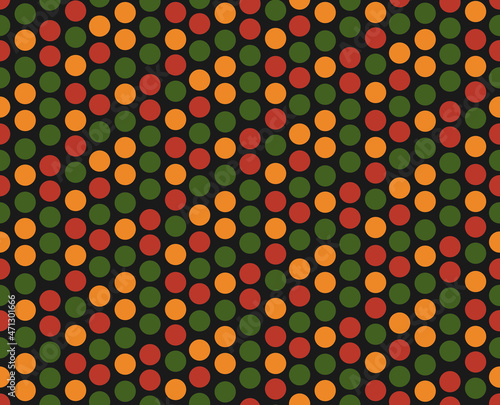 Bright abstract geometric seamless pattern with circles, dots in traditional African colors red, yellow, green on black background. Ditsy backdrop for Kwanzaa, Black History Month, Juneteenth design