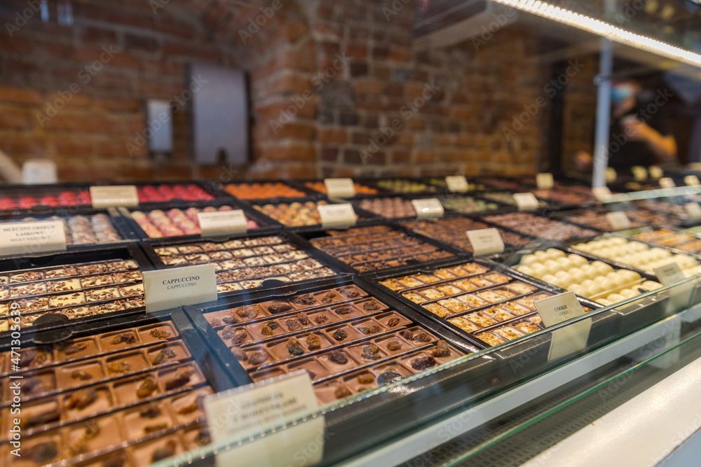 Tasty pralines sold in a cafe, display behind the glass. Treats. Tasty pralines sold in a cafe, display behind the glass. Treats.