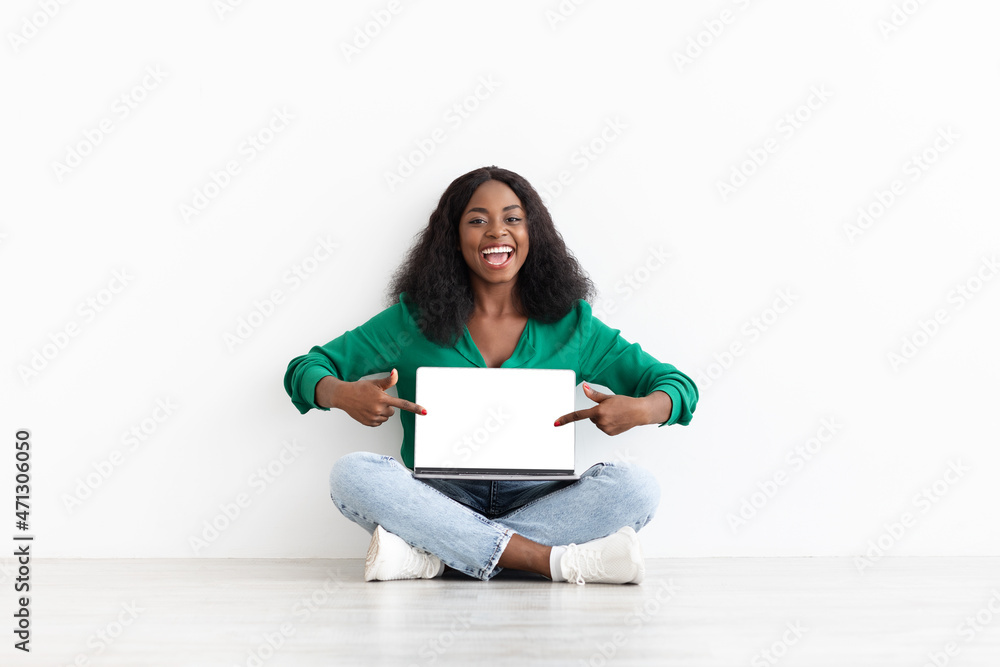 Happy black woman showing computer with empty screen, mockup Happy black woman showing computer with empty screen, mockup