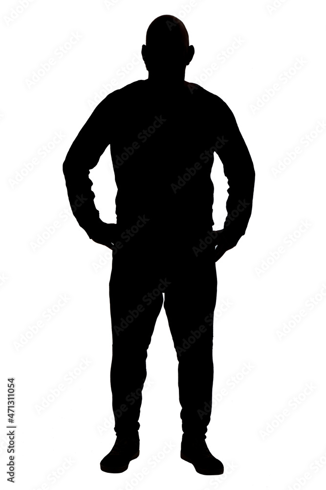 front view of the silhouette of a man wearing casual clothes with his arms on waist front view of the silhouette of a man wearing casual clothes with his arms on waist