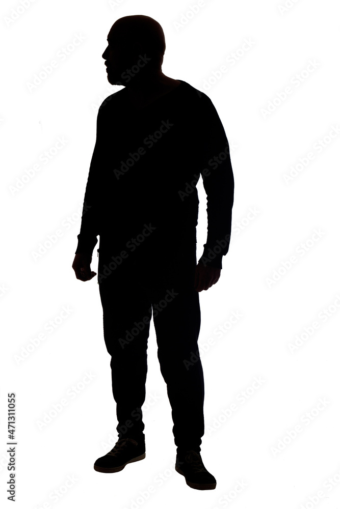 silhouette of a man standing and looking a way on white background