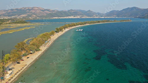 Fototapeta Naklejka Na Ścianę i Meble -  Aerial drone photo of beautiful long sandy organised beach of Drepano in area of Igoumenitsa, Epirus, Greece