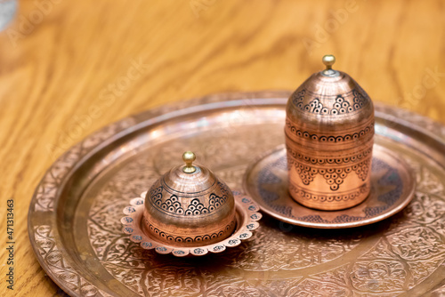 Serving set of traditional Turkish coffee. The metal ornamental coffee service is a symbol of Turkish coffee culture. Popular souvenir and gift from Turkey