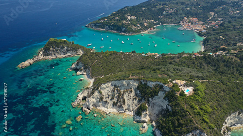 Aerial drone photo of paradise bay and village of Laka visited by yachts and sail boats, island of Paxos, Ionian, Greece