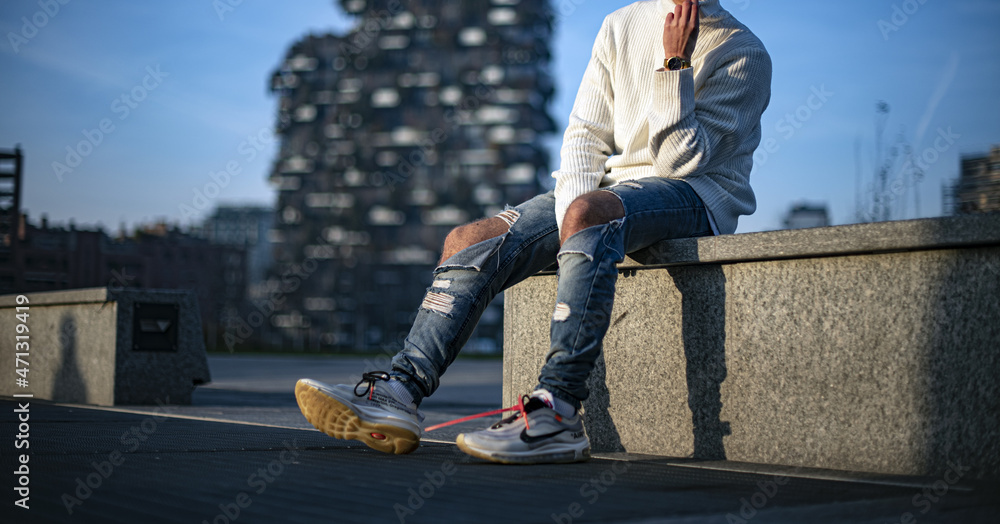 Young man wearing a pair of Nike Air Max 97 Off-White Stock Photo | Adobe  Stock