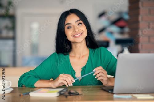 Creative indian woman freelancer working at cafe