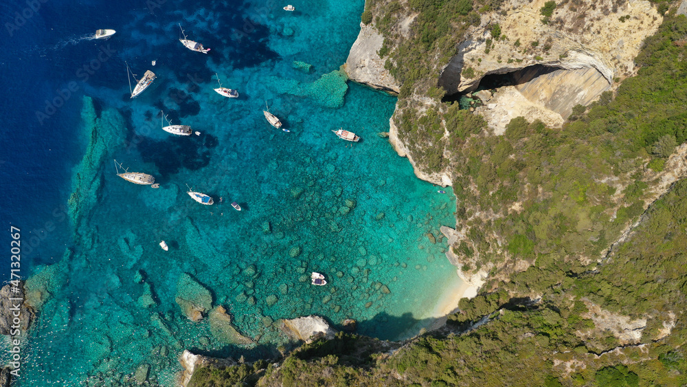 Aerial photo of luxury sail boat anchored in tropical Caribbean rocky turquoise colour seascape Aerial photo of luxury sail boat anchored in tropical Caribbean rocky turquoise colour seascape
