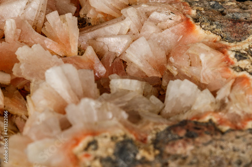 Macro of a stone Stilbite mineral on a black background