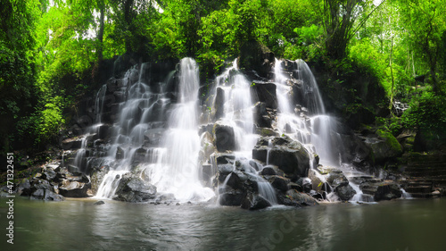 Panoramic view. Kanto Lampo Waterfall in jungle Ubud, Bali island Indonesia. Wallpaper background. Natural scenery.