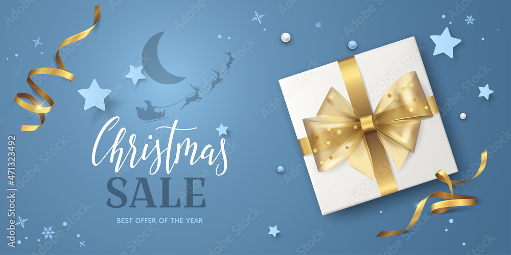 Naklejka premium Blue background for Christmas sale banner with text, gold ribbons, bow, stars, 3D gift box and Santa's sleigh flying around the moon. Vector festive template for flyers of discount or special offers.