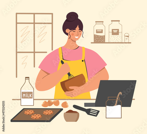 Young woman bakes delicious chocolate chip cookies. Girl watching cooking masterclass on a laptop. Preparing a tasty dessert for the family in the kitchen. Flat vector illustration.