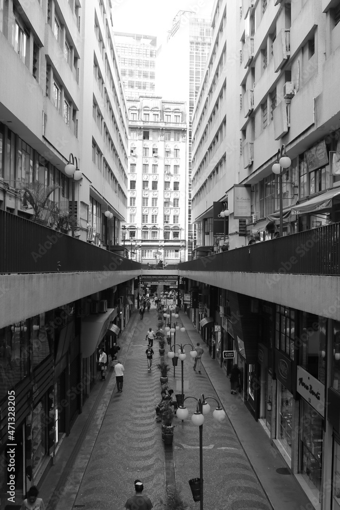 alley with shops between buildings in downtown São Paulo