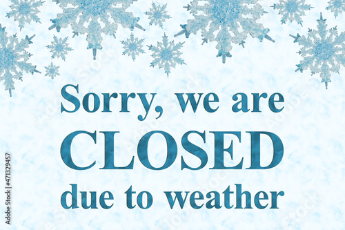 Closed due to weather sign with blue snowflake frame