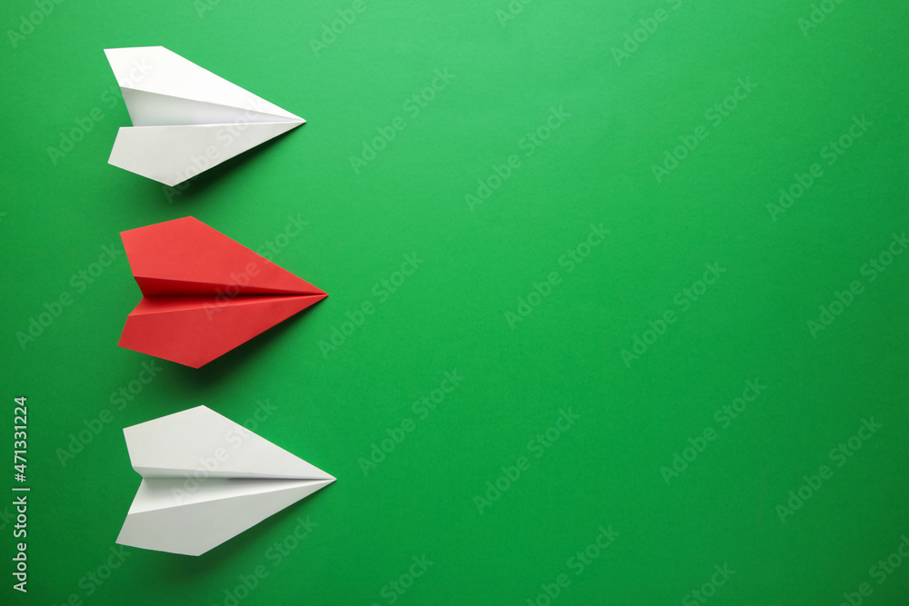 Color paper plane on green background, Business competition concept. Color paper plane on green background, Business competition concept.