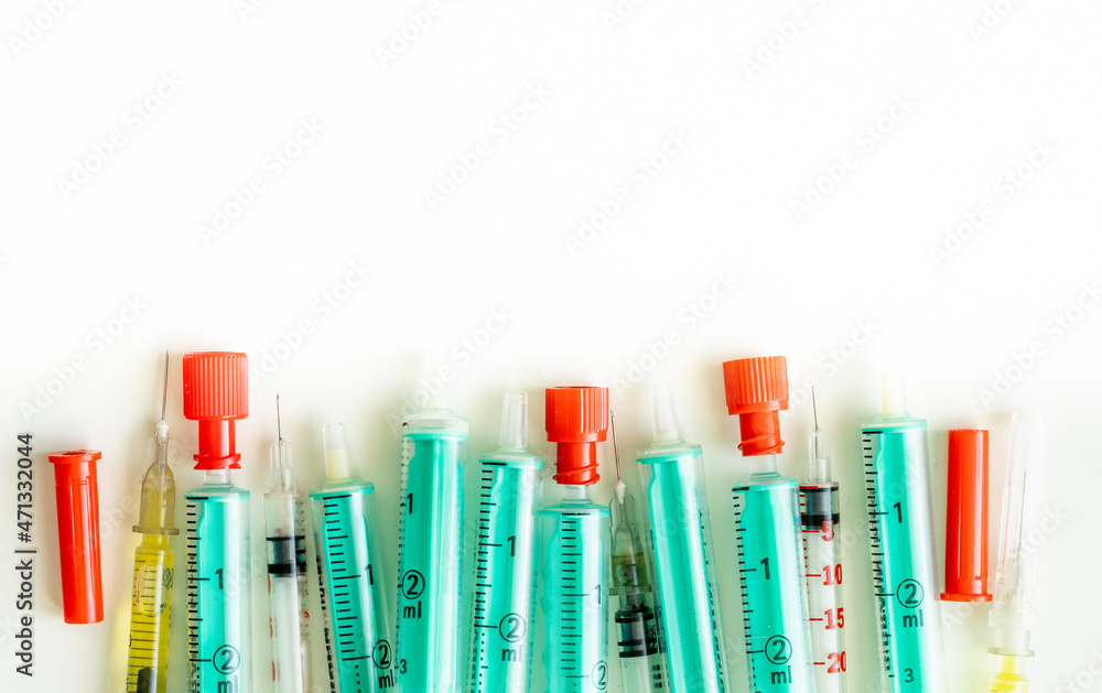 syringes lying on a white background, Place for an inscription, Top view syringes lying on a white background, Place for an inscription, Top view
