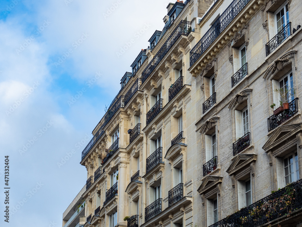Paris, France - November 14th 2021: Typical historic facade of a housing building