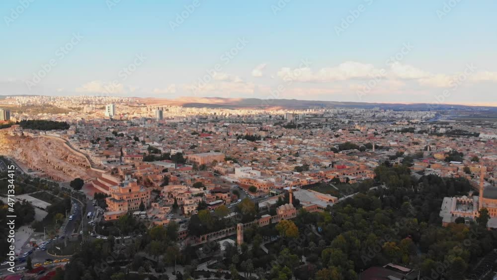 Aerial wide panning view historical Urfa city panorama in Turkey . Famous historical landmark in Turkey. Hometown of Abraham .Sightseeing landmarks in Sanliurfa . 4k high-quality video Aerial wide panning view historical Urfa city panorama in Turkey . Famous historical landmark in Turkey. Hometown of Abraham .Sightseeing landmarks in Sanliurfa . 4k high-quality video