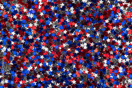 Background of small red, white and blue shiny stars, colors of the flag of united states of america perfect for textures and graphic design backgrounds