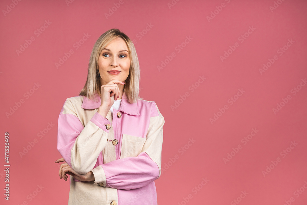 Portrait of a young beautiful cute cheerful blonde woman smiling looking at the camera isolated over pink background. Portrait of a young beautiful cute cheerful blonde woman smiling looking at the camera isolated over pink background.