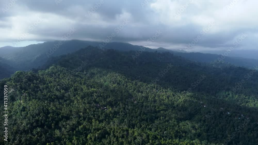 Drone flying near mountains and volcano covered by green trees in Bali Indonesia. High quality 4k aerial footage Drone flying near mountains and volcano covered by green trees in Bali Indonesia. High quality 4k aerial footage