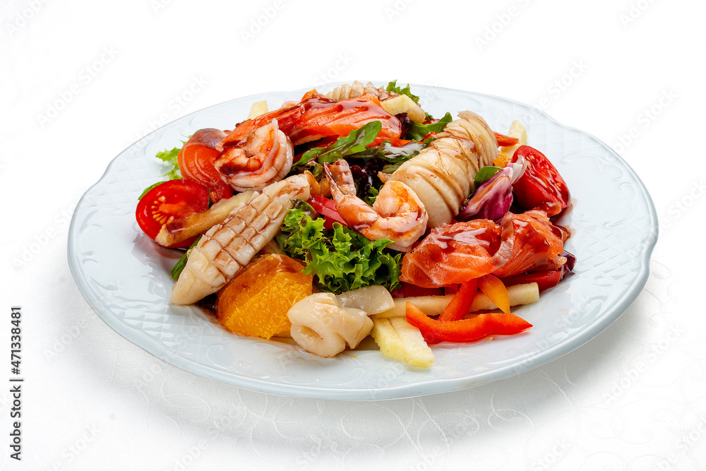 Salad Di Mare .Salad with shrimp, salmon and squid, orange and sweet pepper. Isolated on a white background