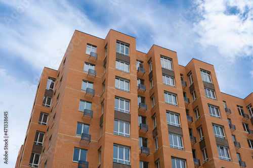 Apartments Building Towers. New building. The facade of the new residential high-rise buildings against the sky. The concept of building a typical residential neighborhood.