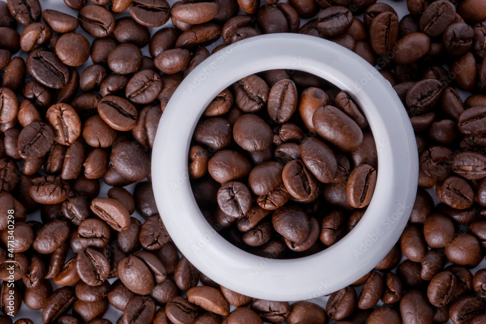 coffee beans in a white cup coffee beans in a white cup