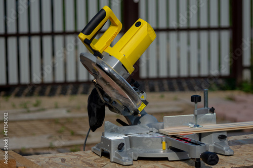 miter saw with yellow body
