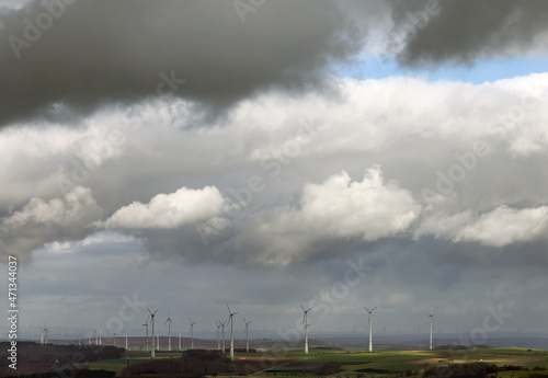 Cloudy sky above wind turbines at plateau near Brilon, Germany