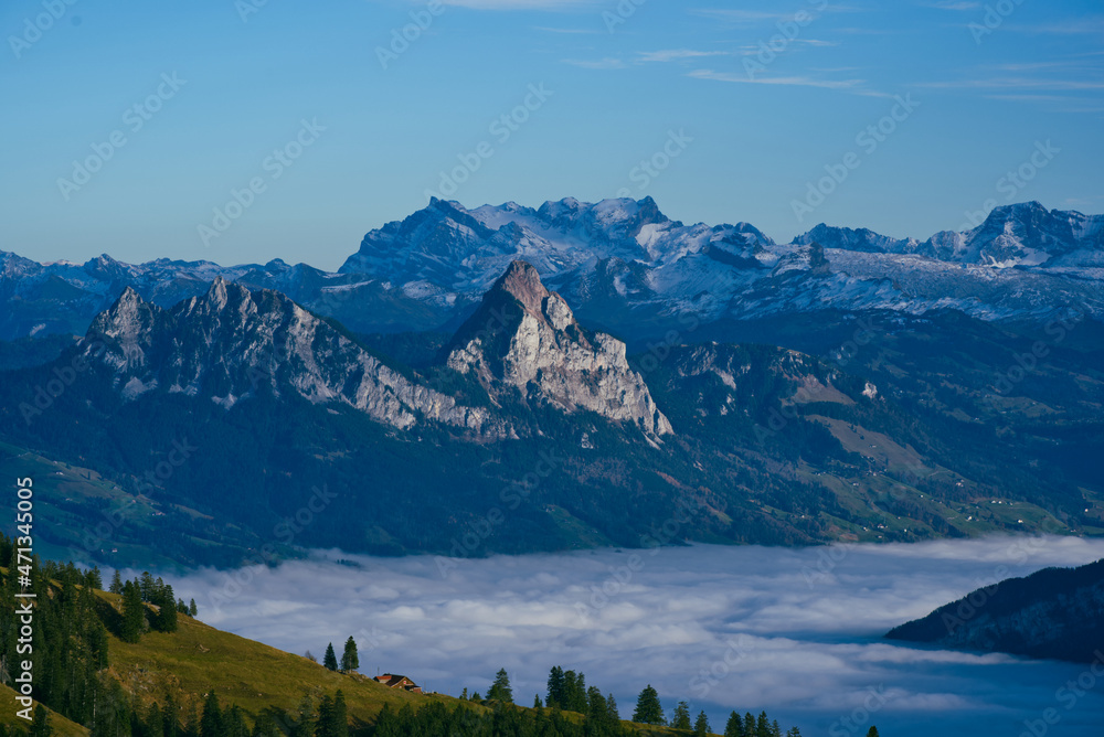 Mythen peaks above sea of fog with Glärnisch peak in the background viewed from Rigi