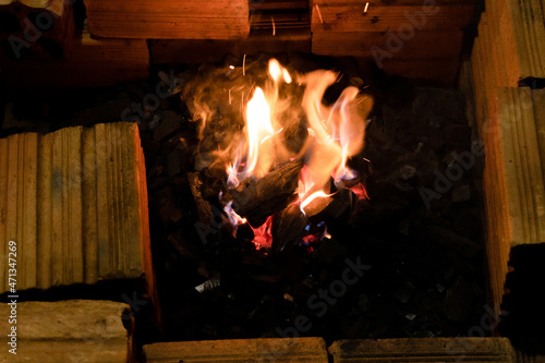 Coal on fire on a Barbecue grill.