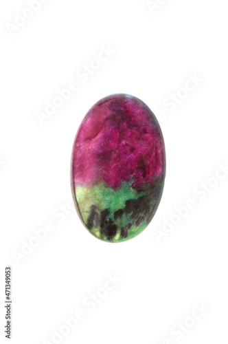 Macro photo of natural Ruby Zoisite polished oval cabochon isolated at white background. Anyolite and Tanganyika artstone. Lithotherapy for heart, root and crown chakras.